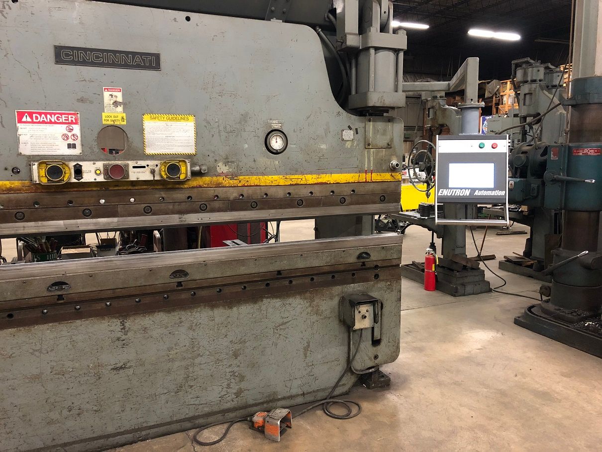 Enu630T CNC control upgrade on Cincinnati 135 FM press brake. Enu630T CNC control retrofits for Cincinnati press brakes. CNC backgauge retrofits Cincinnati.